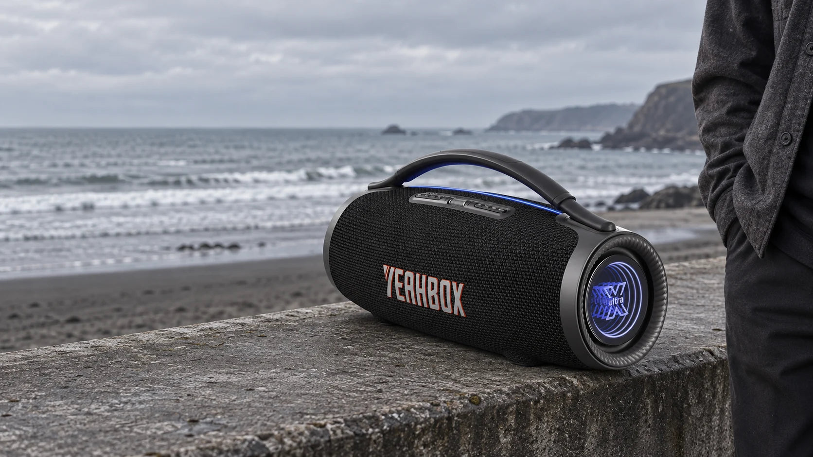 YEAHBOX ULTRA resting on a solid coastal seawall.